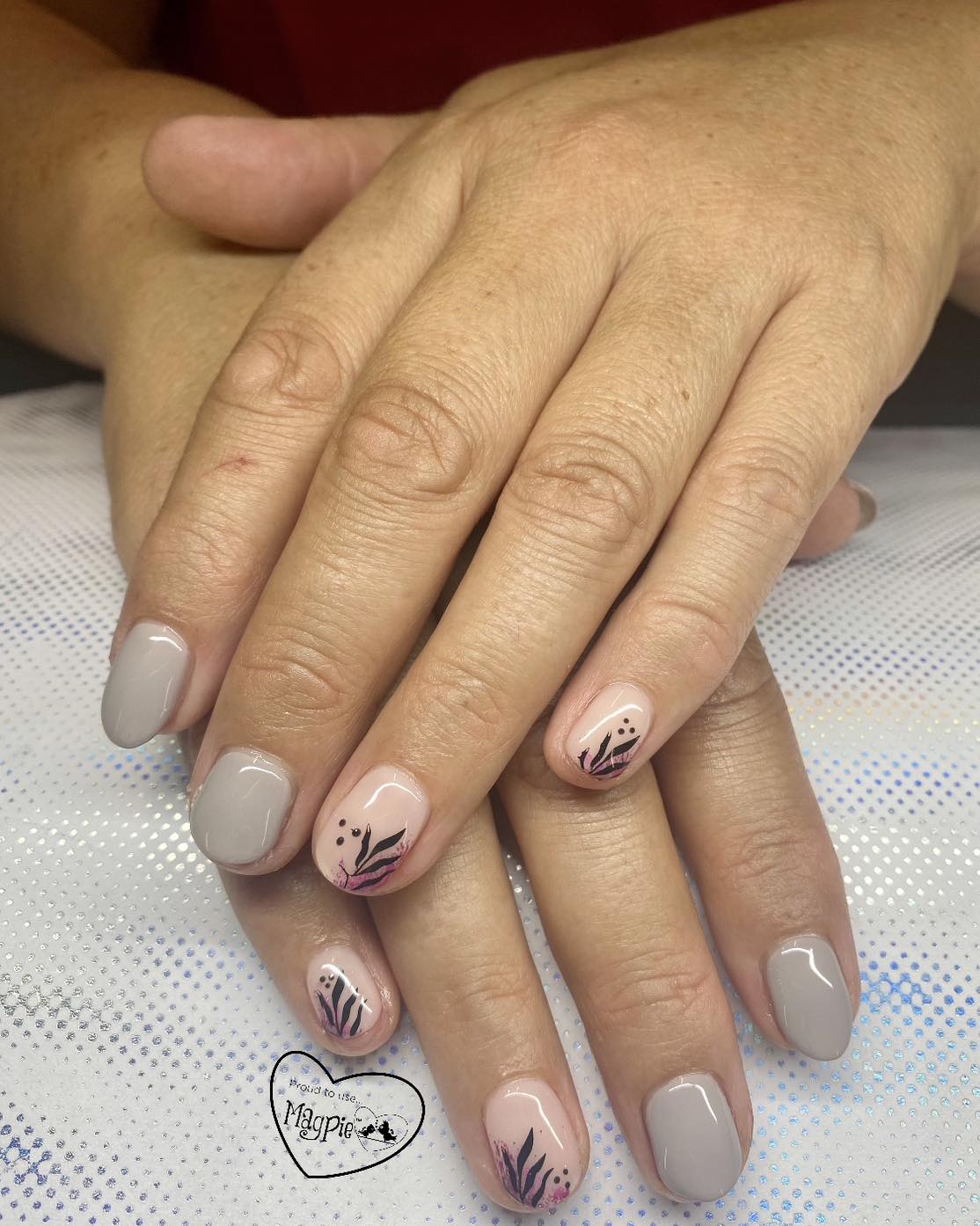 Nude and grey gel nails with botanical nail art