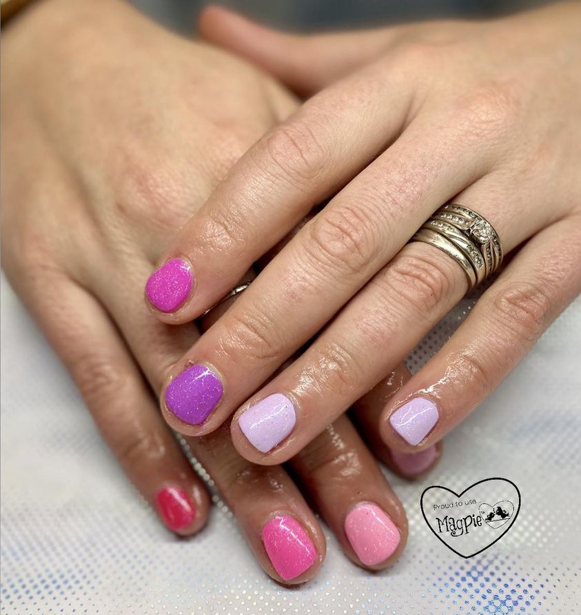 Pink and purple sparkle gel nails by Skyhawk Beauty