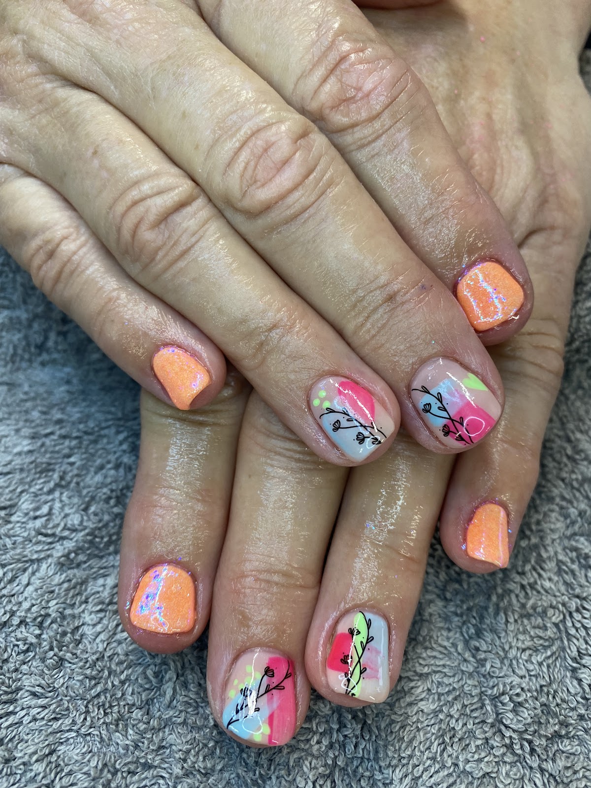 Pastel colour block nails with floral line art